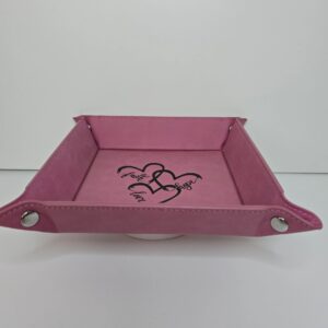 Pink tray with heart design inside.