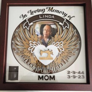 Memorial plaque with photo and dates.