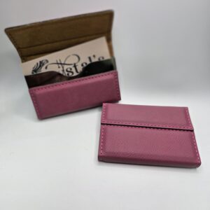 Pink leather card holders on display.
