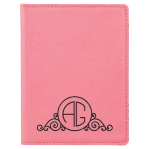 Pink leather cover with decorative initials.