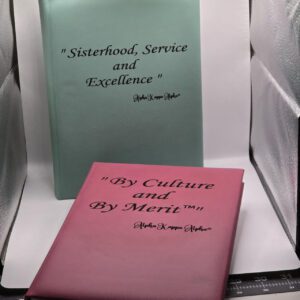 Two pastel sorority books with printed titles